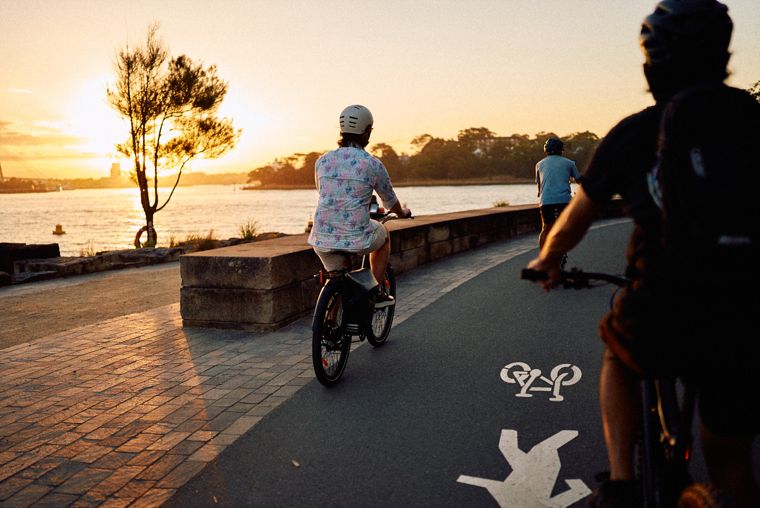Riders at sunset on the waterfront